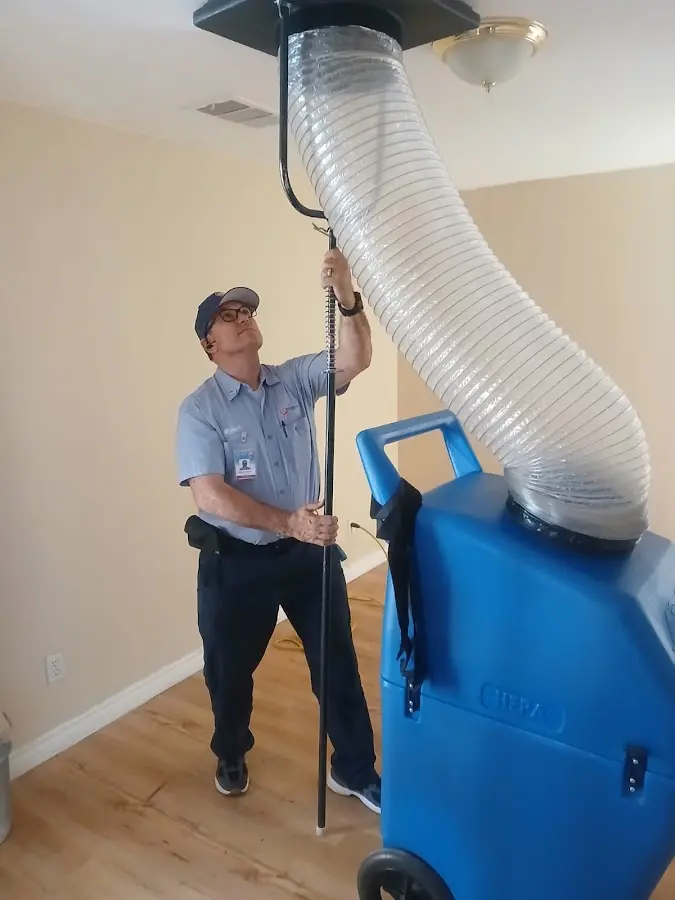 Furnace Tune-Up technician using HEPA equipment in Glassmanor